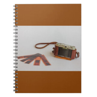 old camera with negative on   photo notebook