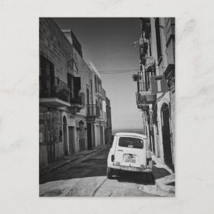 Old car in a street in Italy in black and white Postcard