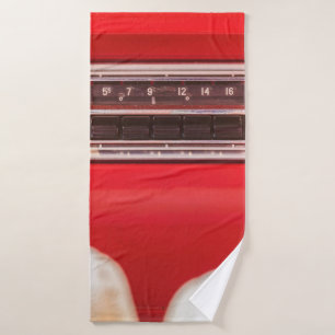 Old car radio inside a red classic American car wi Bath Towel