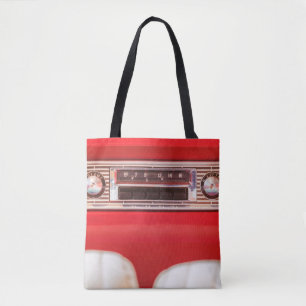 Old car radio inside a red classic American car wi Tote Bag