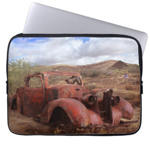 Old Car Rusting In Desert Landscape Laptop Sleeve