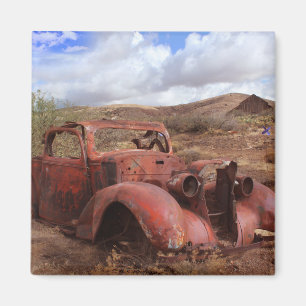 Old Car Rusting In Desert Landscape Magnet