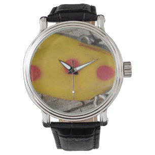 old  fishing  lure yellow and orange spot watch
