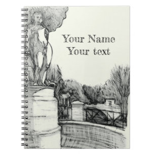 Old fountain in the park with sculpture boy notebook