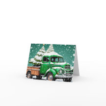 Old Green Truck with Christmas Tree in the back.