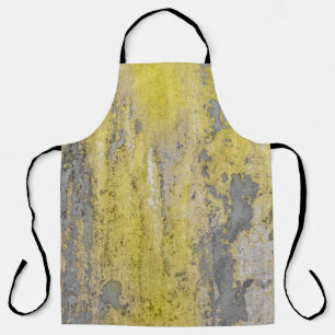 Old grey concrete wall with peeling yellow paint. apron