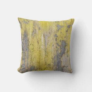 Old grey concrete wall with peeling yellow paint.  cushion