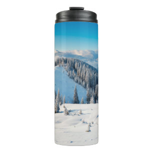 Old grunge wooden texture or background with termi thermal tumbler