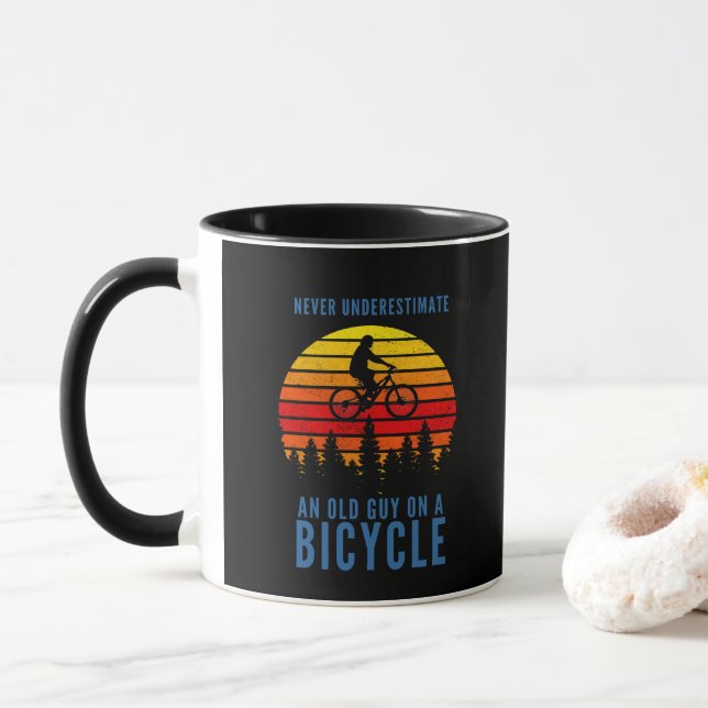 Old Guy On A Bicycle Never UNderestimate Mug (With Donut)