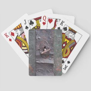 Old lock with key playing cards