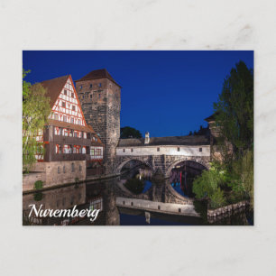 Old medieval bridge at night in Nuremberg, German Postcard