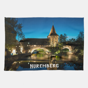 Old medieval bridge at night in Nuremberg Tea Towel
