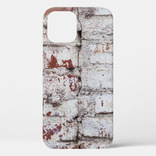 Old painted brick wall with peeling white paintwal iPhone 12 case