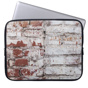 Old painted brick wall with peeling white paintwal laptop sleeve