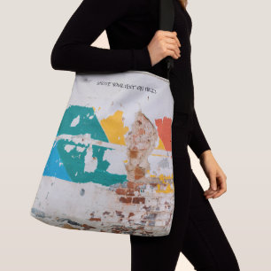 Old painted wall with graffiti crossbody bag