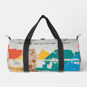 Old painted wall with graffiti  duffle bag