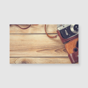 Old Retro Camera On Wooden Table Background