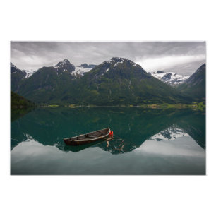 Old rowboat with mountain reflection photo print