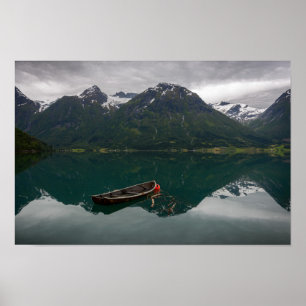 Old rowboat with mountain reflection poster