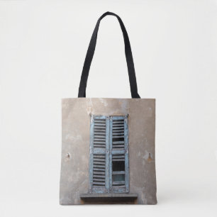 Old ruined wooden window of old houseancient,antiq tote bag