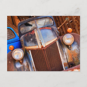 Old rusty truck on a farm postcard