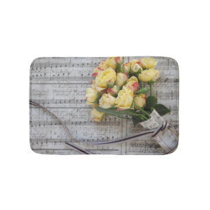 Old sheet music with yellow roses bath mat