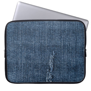 Old torn denim: jeans texture. laptop sleeve