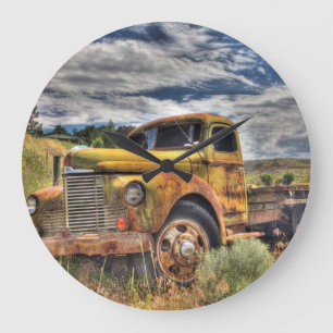 Old truck abandoned in field large clock