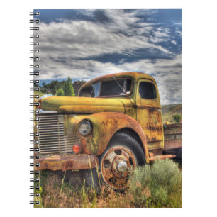 Old truck abandoned in field notebook