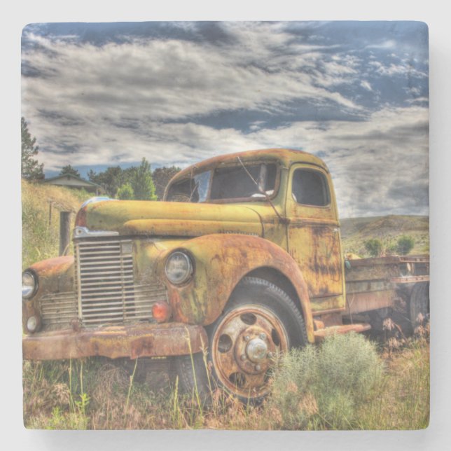 Old truck abandoned in field stone coaster (Front)