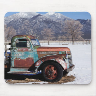 Old truck sitting in the field mouse pad