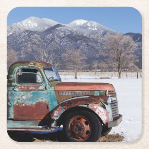 Old truck sitting in the field square paper coaster
