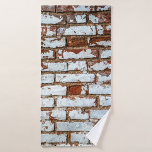 Old vintage brick wall with sprinkled white plaste bath towel