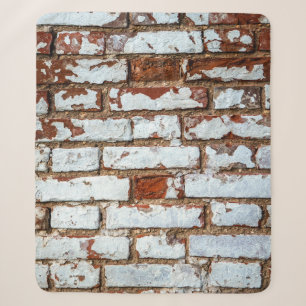 Old vintage brick wall with sprinkled white plaste sherpa blanket