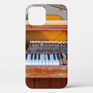 Old vintage piano with the lid off. A dilapidated iPhone 12 Case