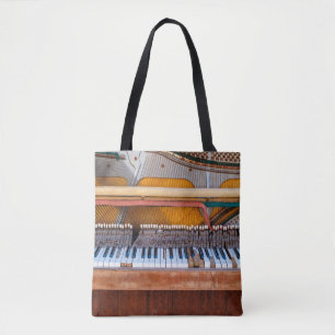 Old vintage piano with the lid off. A dilapidated Tote Bag