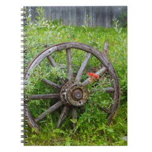 Old wagon wheel in historic old gold town 3 notebook