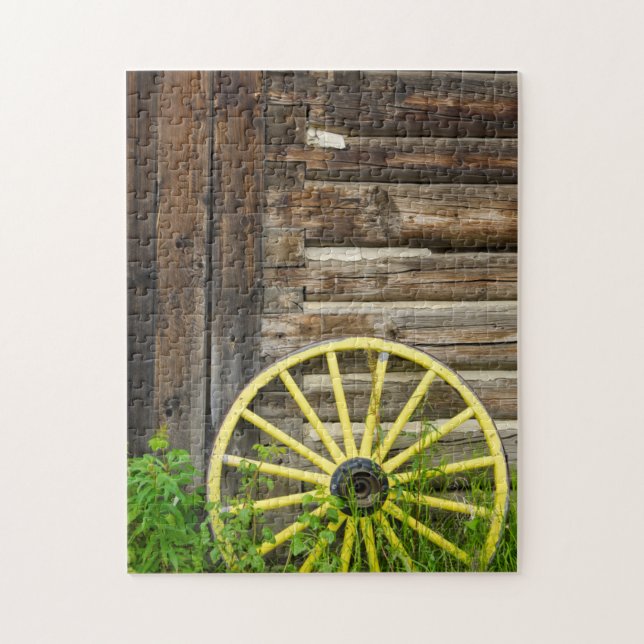 Old wagon wheel in historic old gold town jigsaw puzzle (Vertical)