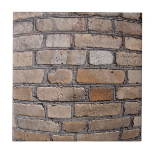 Old wall from grey and brown bricks tile