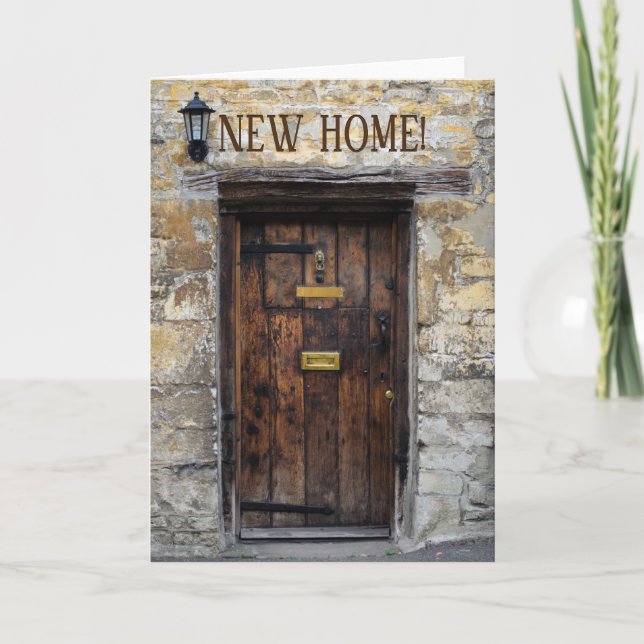 Old wooden front door with light new home card (Front)