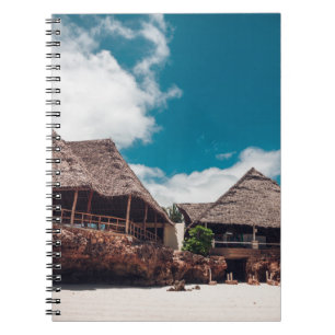 Old wooden tropical bungalow on the beachancient,a notebook