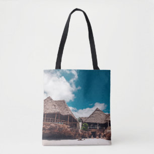 Old wooden tropical bungalow on the beachancient,a tote bag