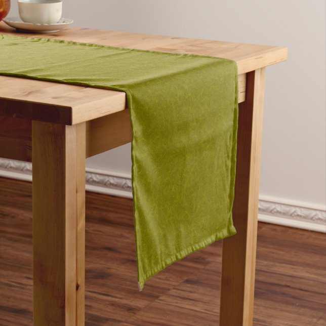 Olive green surface with subtle swirling pattern short table runner (In Situ)