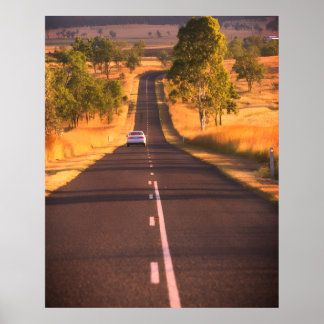 On the Road Again a Long Stretch of Road on a Wall Poster