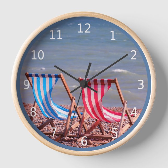 On vacation.  Two deckchairs on the beach Clock (Front)