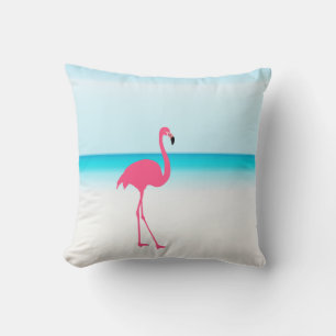 One cute pink flamingo on the beach cushion