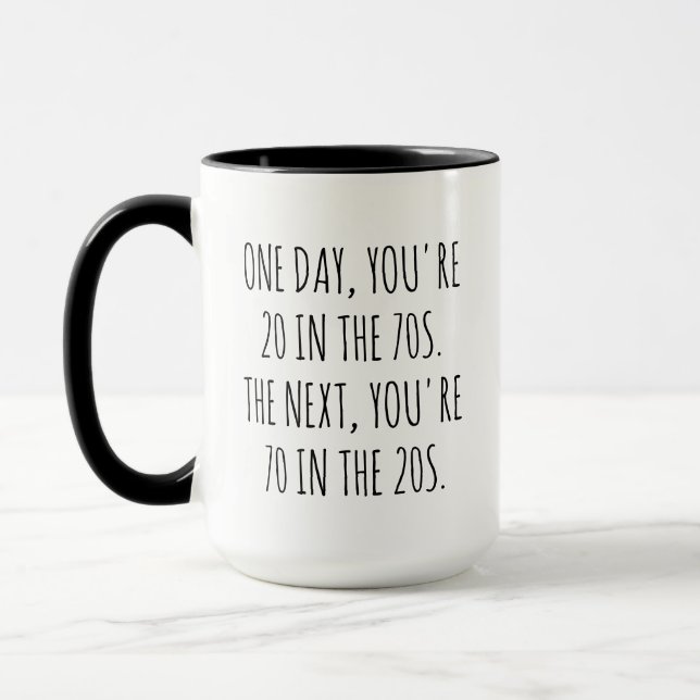 ONE DAY YOU'RE 20 IN THE 70S THE NEXT YOU'RE 70  MUG (Left)