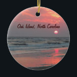 One Perfect Sunset - Oak Island, NC Ceramic Ornament<br><div class="desc">This is a photo of a really beautiful sunset at Oak Island, North Carolina. The sun's light is filtered by some later afternoon clouds, causing it to look like a hot ball of wax as it prepares to sink into the ocean. Brilliant pink and orange are reflected by the wet...</div>