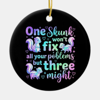 One skunk won't fix all your problems but three  ceramic ornament