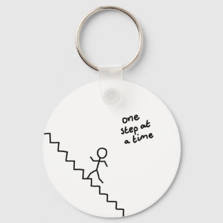 "one step at a time" stick man on stairs keychain